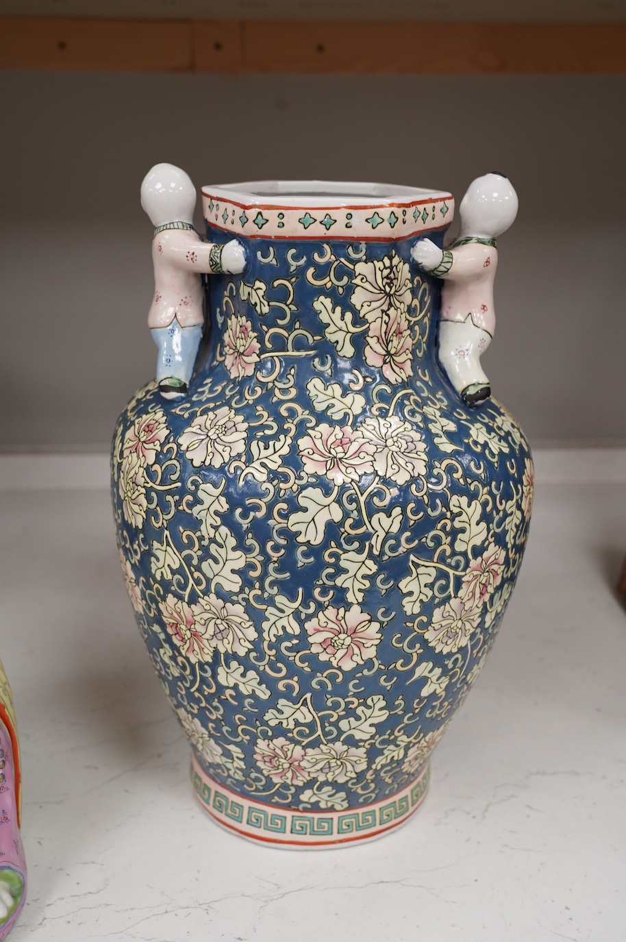 A 20th century Chinese famille rose Buddha, a ‘hundred boys’ vase and a boxed set of cloisonné boxes, vase 34cm. Condition - cloisonné boxes good, Buddha has missing decoration to robe near right hand and vase good